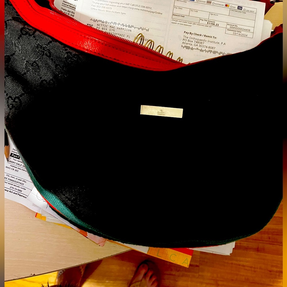 Gucci purse black with red leather strap; red & green accents; very very clean